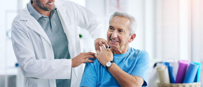 doctor with hand on a patients shoulder